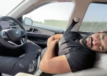 mahindar xuv700 adas misuse-man sleeping driver seat
