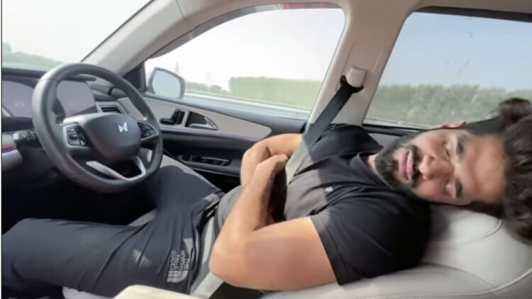 mahindar xuv700 adas misuse-man sleeping driver seat