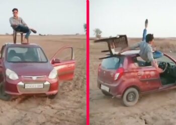 Man Sits on Roof of Moving Maruti Alto