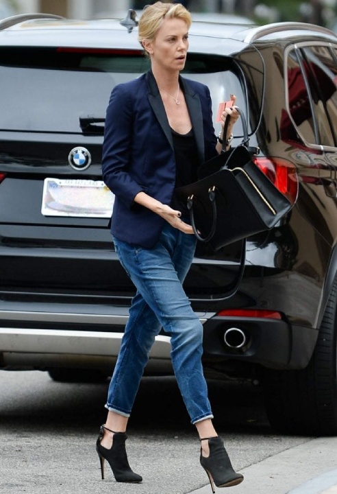 Charlize Theron with Bmw X5