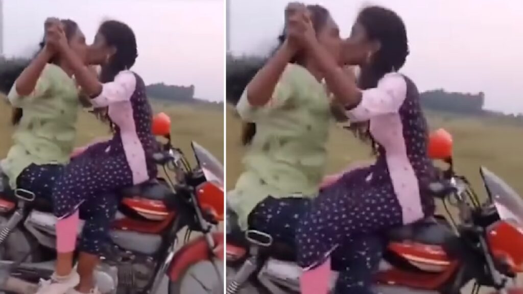 Girls Kissing on a Moving Bike