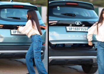 Girl Lifting Tailgate of Tata Safari