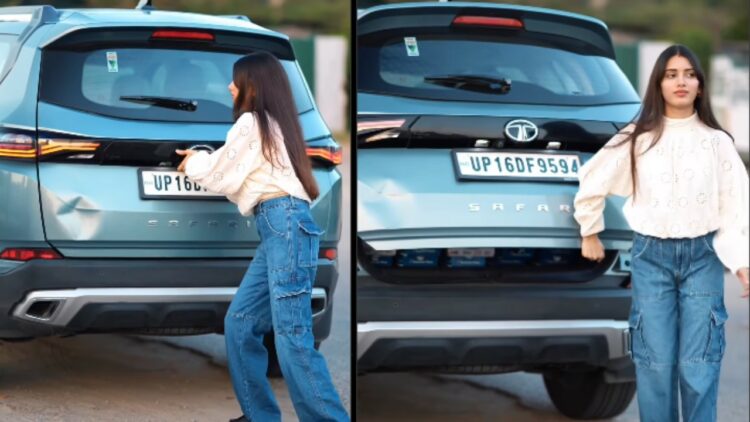 Girl Lifting Tailgate of Tata Safari