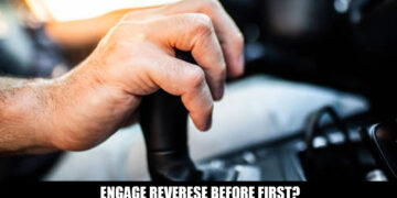 hand shifting car gear lever