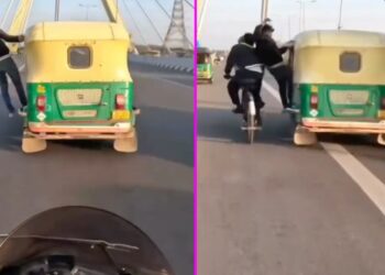 Man Hanging Out of Auto Rickshaw Hits Cyclist