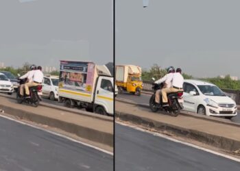 Traffic Police Riding Bike on Median