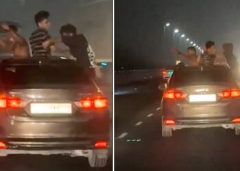 Youngsters Hang Out of Sunroof and Windows of Honda City