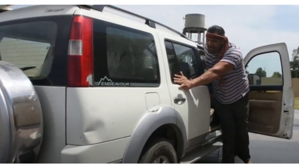 the Great Khali with His Ford Endeavour