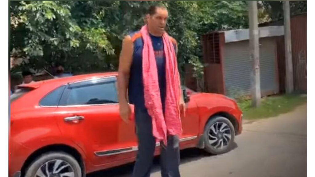 the Great Khali with His Maruti Baleno