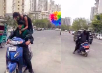 Girl Standing on Moving Scooter on Holi Falls on Road