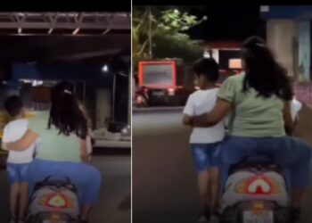 Parents Ride Scooter Holding Child Along
