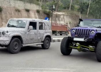 Mahindra Thar 5-door next to lifted 3-door Thar - Front Three Quarters