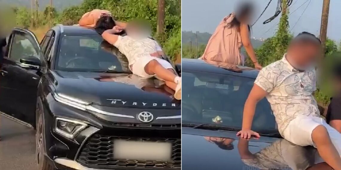 Couple Seen Sleeping on Roof and Bonnet of Moving Car