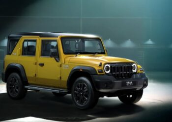 mahindra thar roxx star edition yellow black paint theme front three quarters