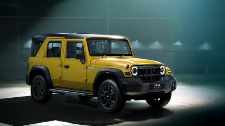 mahindra thar roxx star edition yellow black paint theme front three quarters